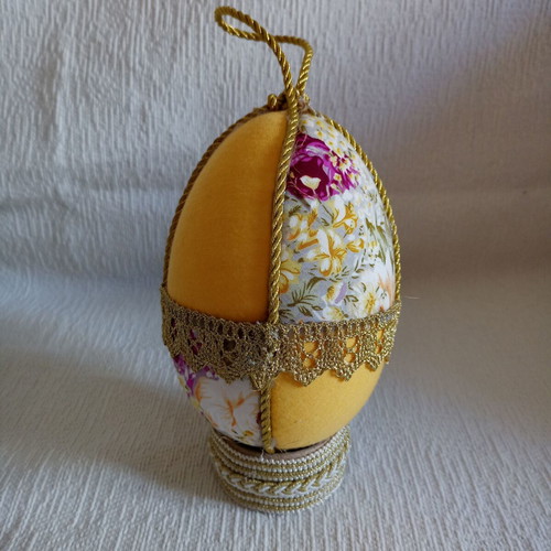Decorative yellow floral egg used for Easter and spring decor
