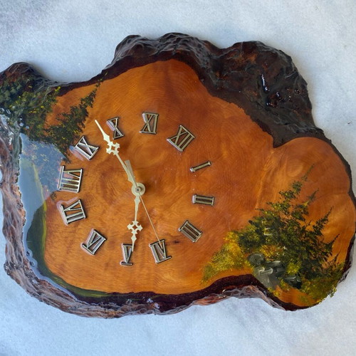 Handmade wooden wall clock from tree trunk.