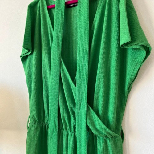 Emerald green one-piece jumpsuit with sleeves and waist belt