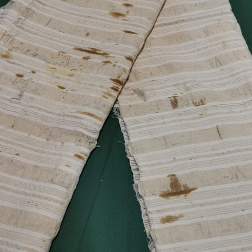 Woven bed sheet used with time stain from 1920 era