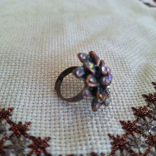 Bronze flower ring with pink rhinestones used