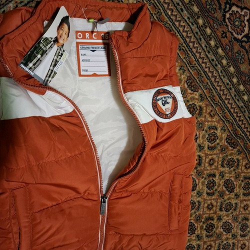 Orchestra sleeveless jacket new for boys 8 years old, orange and white