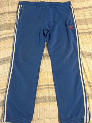 Adidas tracksuit pants size L used, blue with zip pockets