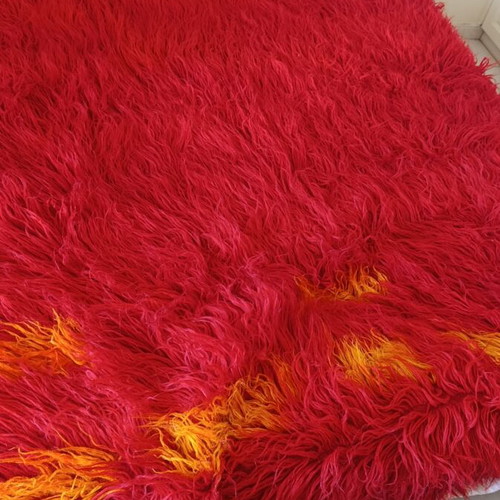 Long pile bed cover blanket, red with orange details