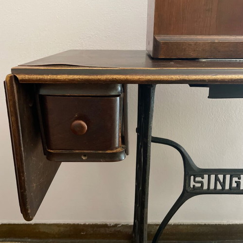 Singer 1960 foot-powered sewing machine used, wooden cover and table