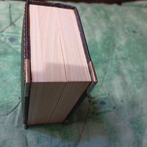 Silver cufflinks in book-style case