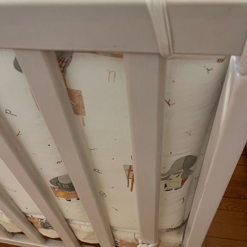 Baby cot like new with unused bedding set and cot bumper
