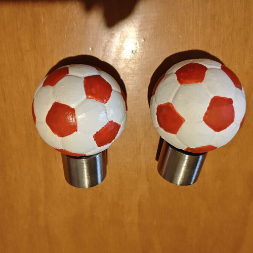 Football curtain rod finials, pair, red and white