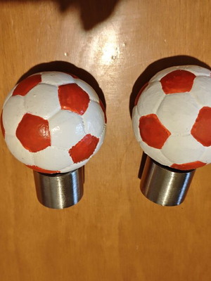 Football curtain rod finials, pair, red and white