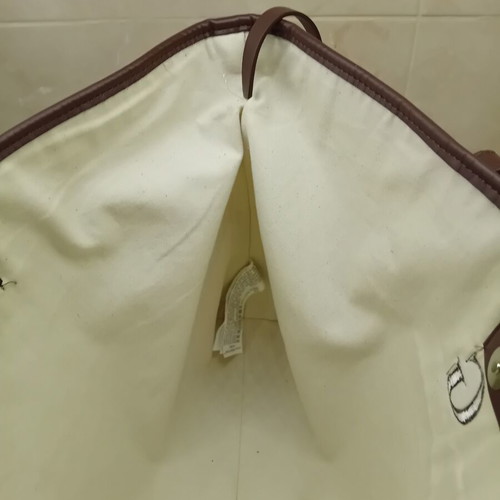 Large beige fabric shoulder bag with brown leather details
