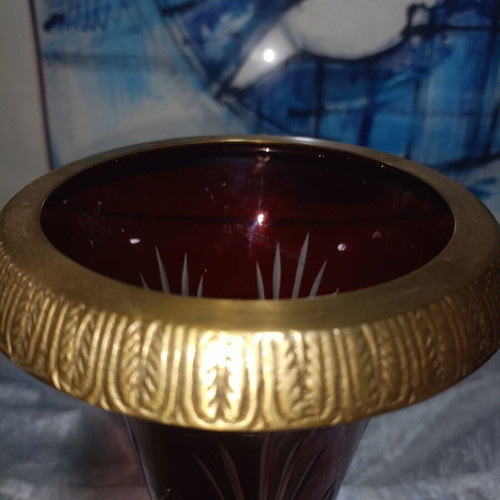 Vintage red glass vase with cut designs and decorative brass base and rim