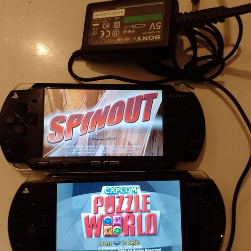 PlayStation Portable (PSP) used, 2 devices with original charger