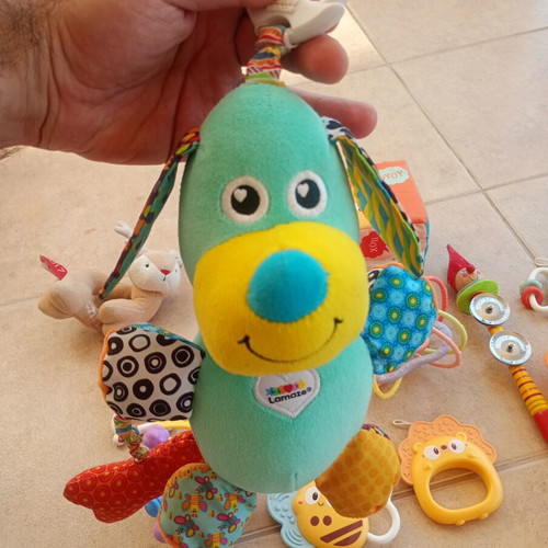 Set of 32 baby rattles including plush toys and large dice