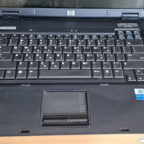 HP Compaq NX6110 laptop used without hard drive, battery, and charger