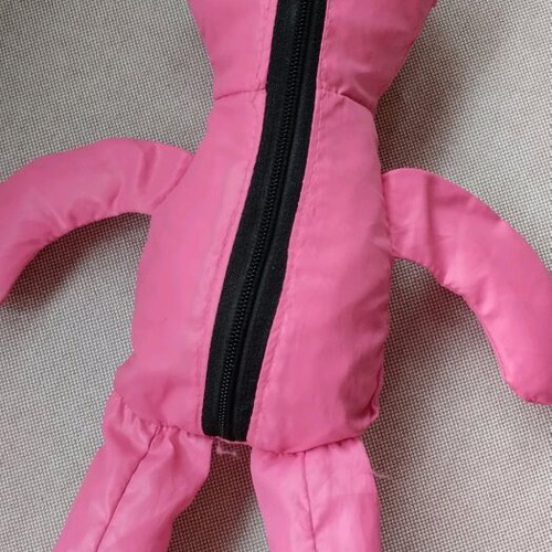 Fuchsia shoulder bag used for shopping with teddy bear pouch