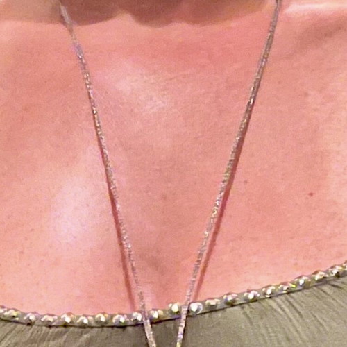 Long cord necklace adjustable, like new, metallic gold color