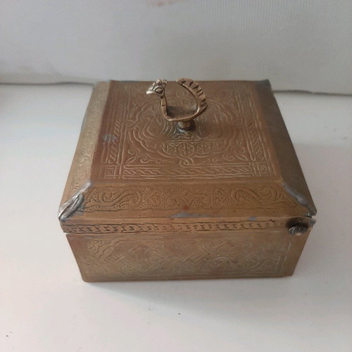 Oriental copper box used with carved decorations