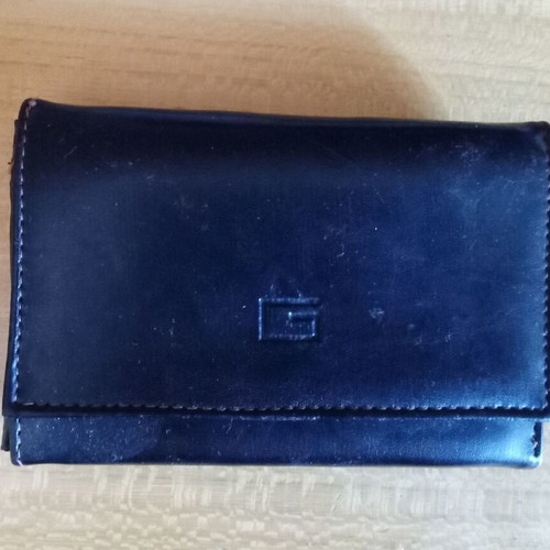 Women's black wallet used with photo and money slots
