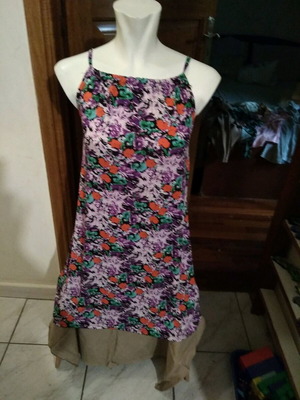 Dress used with green, orange and purple flowers, short length