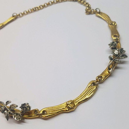 Necklace with embossed roses in gold and silver tones