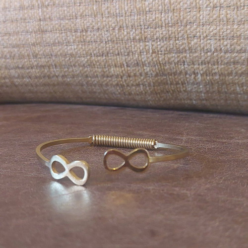 Gold infinity handcuff bracelet like new