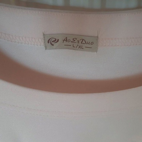 Pink women's blouse used with silver detail