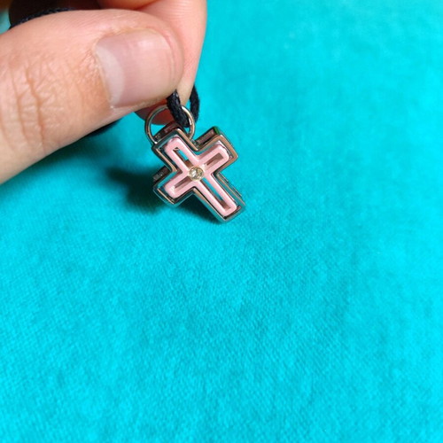 Cross made of silver and pink stainless steel new with adjustable cord