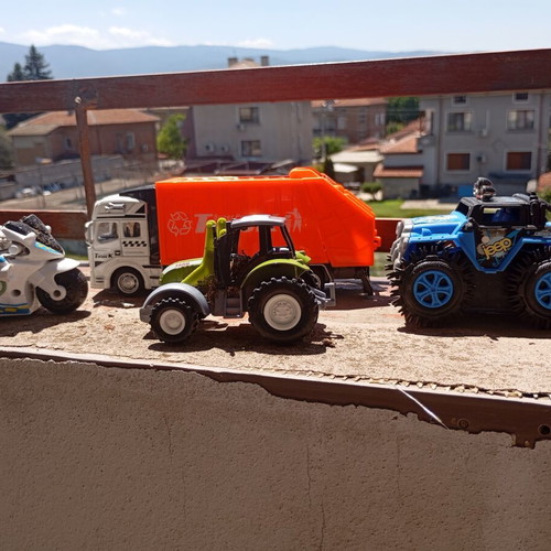 Lot of 4 used medium-sized children's toy vehicles