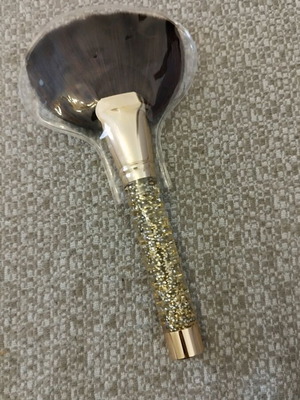 Makeup brush new, gold with glitter and soft bristles
