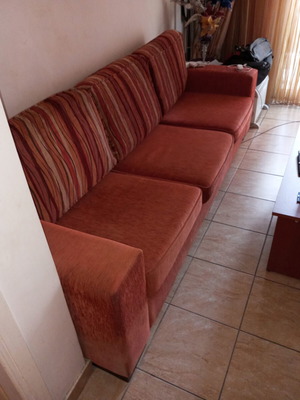 Three-seater sofa used with storage space and removable cushions