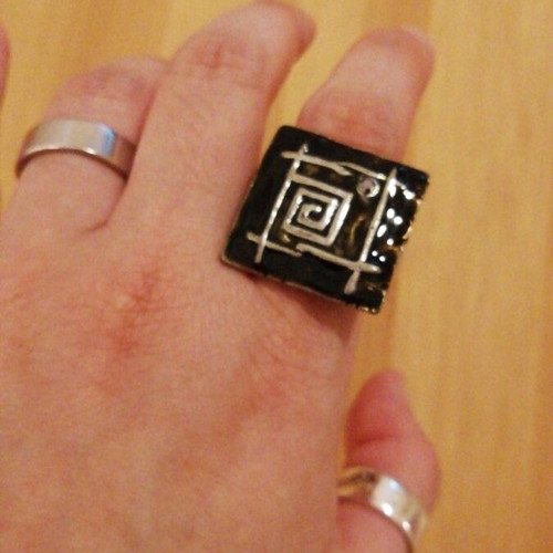 Square statement ring used with black enamel and silver geometric design