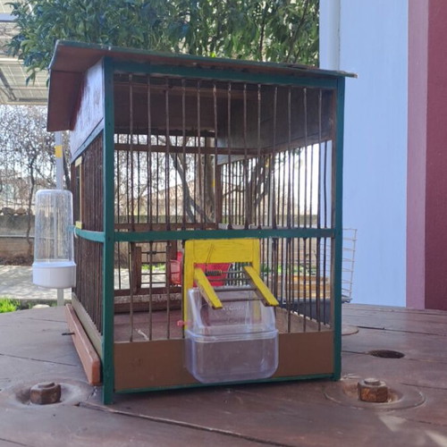 Handmade birdcage with feeder, waterer, nest, and egg holder