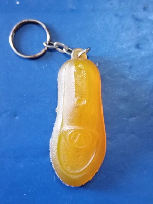 Vintage keychain in shoe shape used