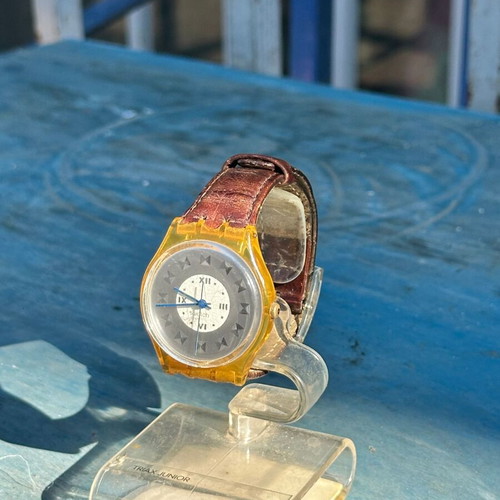 Vintage Swatch Swiss watch 34mm, transparent yellow case, brown strap