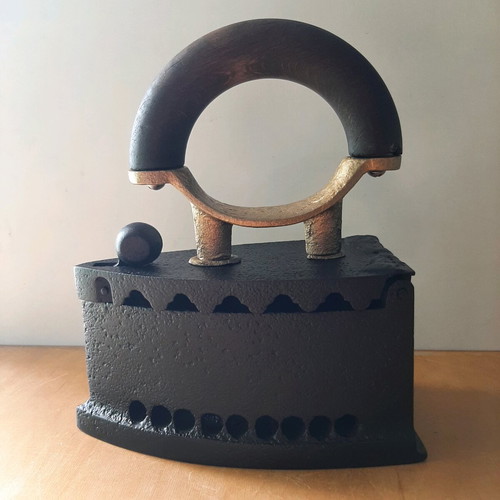 Charcoal iron used from 1920-30 with thorough restoration