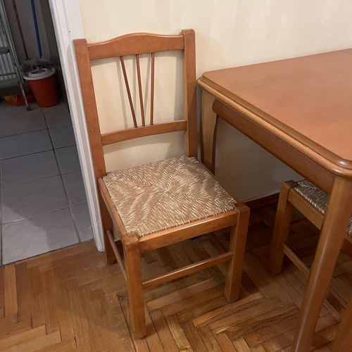 Wooden dining set used with 4 chairs and wicker seats