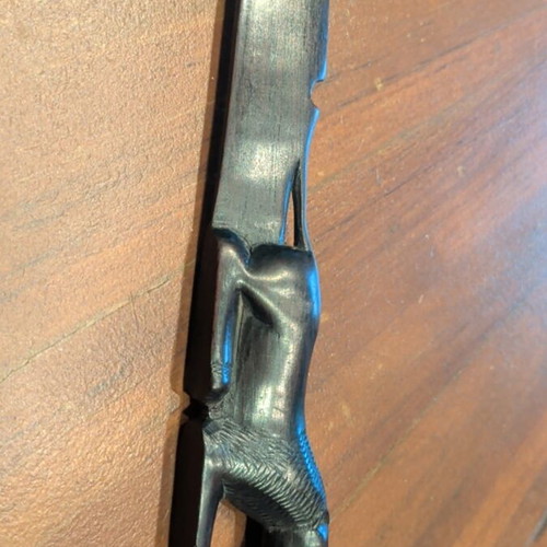 Wooden paper cutter used with handmade African art carving