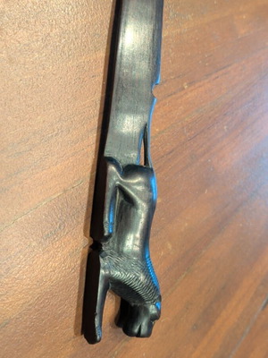 Wooden paper cutter used with handmade African art carving