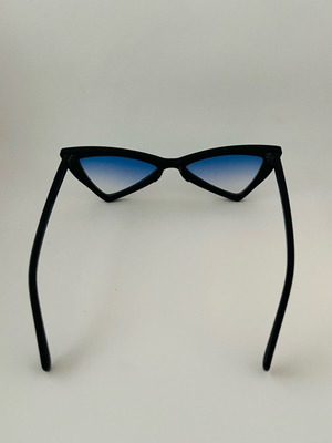 Glasses with blue triangular lens used, black frame