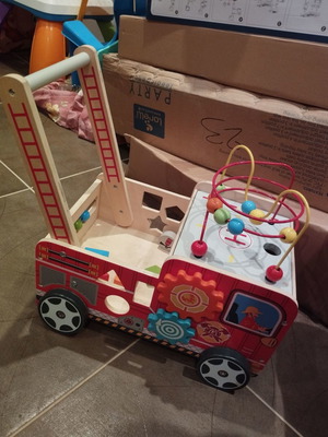 Wooden walker with activities used