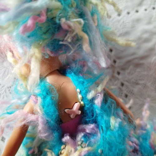Doll with handmade dress and hat used
