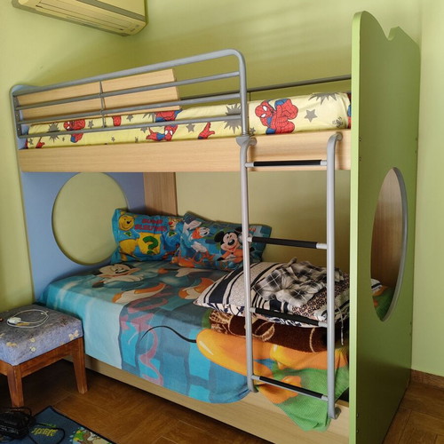Bunk bed with three mattresses used, includes desk and drawers