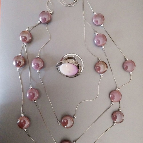 Jewelry set used in lilac shades with necklace, ring, and shell bracelet
