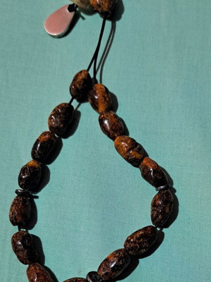 Amber Komboloi like new with silver handmade finish and insect bead