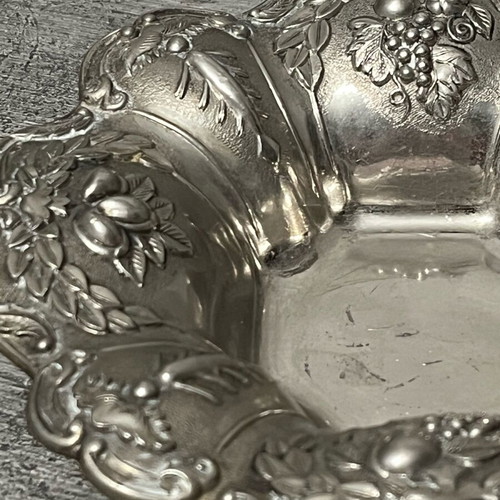 Decorative metal bowl used with embossed design