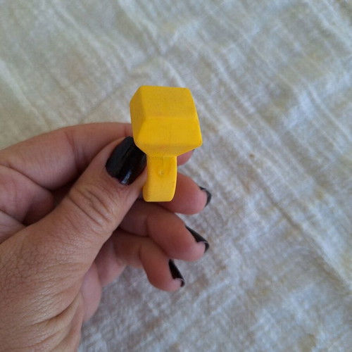 Yellow eraser in ring shape like new