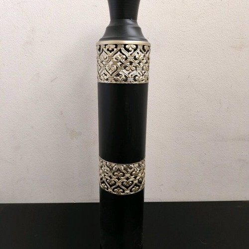 Metal vase in black color with bronze designs like new