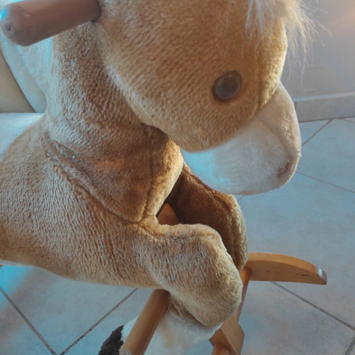 Wooden rocking horse like new with plush carriage