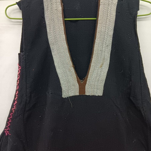 Traditional collectible wool dress used with wear due to age