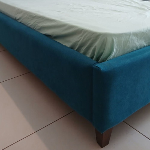 Single bed with teal fabric headboard and mattress, like new